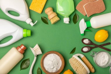 Eco cleaning.Cleaning products on a textured background. Eco-friendly home cleaning. A bottle of natural detergent surfaces, eco brushes, sponges, and rags. Cleaner concept.Cleaning supplies.Flat lay.