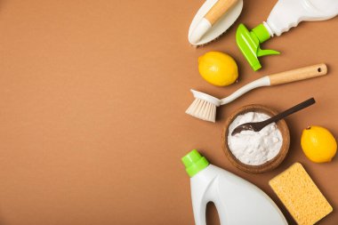 Eco cleaning.Cleaning products on a textured background. Eco-friendly home cleaning. A bottle of natural detergent surfaces, eco brushes, sponges, and rags. Cleaner concept.Cleaning supplies.Flat lay.