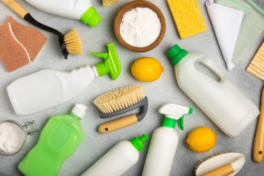 Eco cleaning.Cleaning products on a textured background. Eco-friendly home cleaning. A bottle of natural detergent surfaces, eco brushes, sponges, and rags. Cleaner concept.Cleaning supplies.Flat lay.