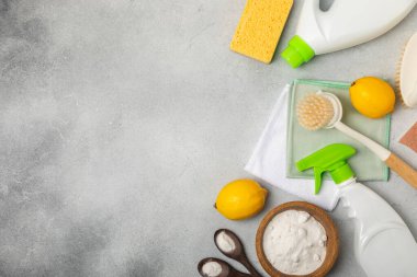 Eco cleaning.Cleaning products on a textured background. Eco-friendly home cleaning. A bottle of natural detergent surfaces, eco brushes, sponges, and rags. Cleaner concept.Cleaning supplies.Flat lay.