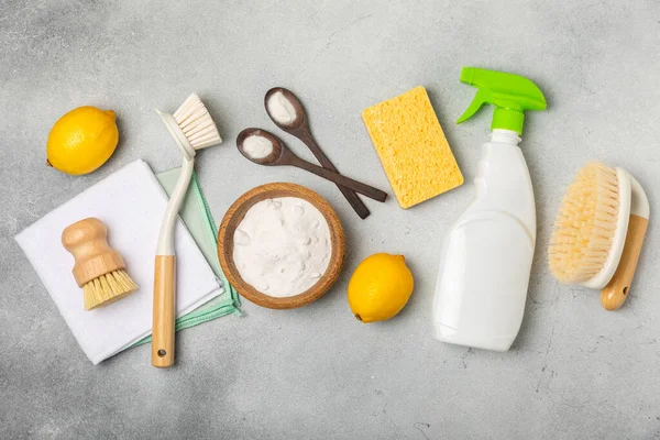 Eco cleaning.Cleaning products on a textured background. Eco-friendly home cleaning. A bottle of natural detergent surfaces, eco brushes, sponges, and rags. Cleaner concept.Cleaning supplies.Flat lay.
