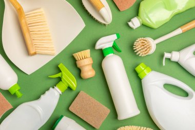 Eco cleaning.Cleaning products on a textured background. Eco-friendly home cleaning. A bottle of natural detergent surfaces, eco brushes, sponges, and rags. Cleaner concept.Cleaning supplies.Flat lay.
