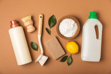 Eco cleaning.Cleaning products on a textured background. Eco-friendly home cleaning. A bottle of natural detergent surfaces, eco brushes, sponges, and rags. Cleaner concept.Cleaning supplies.Flat lay.