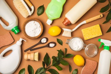 Eco cleaning.Cleaning products on a textured background. Eco-friendly home cleaning. A bottle of natural detergent surfaces, eco brushes, sponges, and rags. Cleaner concept.Cleaning supplies.Flat lay.