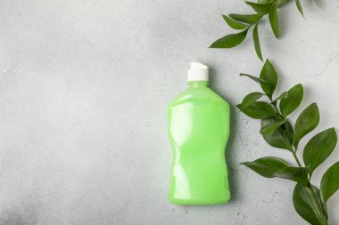 Eco cleaning.Cleaning products on a textured background. Eco-friendly home cleaning. A bottle of natural detergent surfaces, eco brushes, sponges, and rags. Cleaner concept.Cleaning supplies.Flat lay.