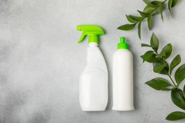 Eco cleaning.Cleaning products on a textured background. Eco-friendly home cleaning. A bottle of natural detergent surfaces, eco brushes, sponges, and rags. Cleaner concept.Cleaning supplies.Flat lay.