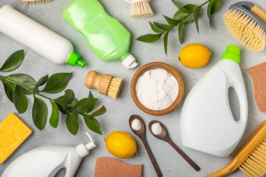 Eco cleaning.Cleaning products on a textured background. Eco-friendly home cleaning. A bottle of natural detergent surfaces, eco brushes, sponges, and rags. Cleaner concept.Cleaning supplies.Flat lay.