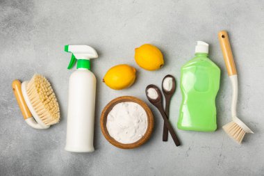 Eco cleaning.Cleaning products on a textured background. Eco-friendly home cleaning. A bottle of natural detergent surfaces, eco brushes, sponges, and rags. Cleaner concept.Cleaning supplies.Flat lay.