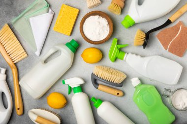 Eco cleaning.Cleaning products on a textured background. Eco-friendly home cleaning. A bottle of natural detergent surfaces, eco brushes, sponges, and rags. Cleaner concept.Cleaning supplies.Flat lay.