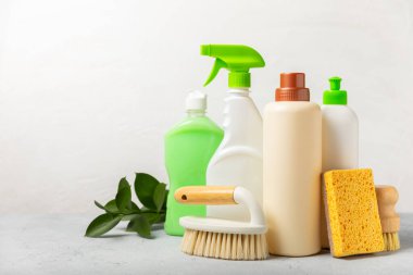 Eco cleaning.Cleaning products on a textured background. Eco-friendly home cleaning. A bottle of natural detergent surfaces, eco brushes, sponges, and rags. Cleaner concept.Cleaning supplies.Flat lay.