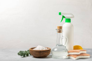 Eco cleaning.Cleaning products on a textured background. Eco-friendly home cleaning. A bottle of natural detergent surfaces, eco brushes, sponges, and rags. Cleaner concept.Cleaning supplies.Flat lay.