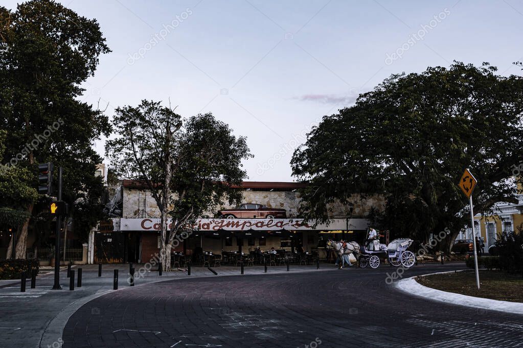 Merida, Yucatan, Mexico, Street scene with a building that says 