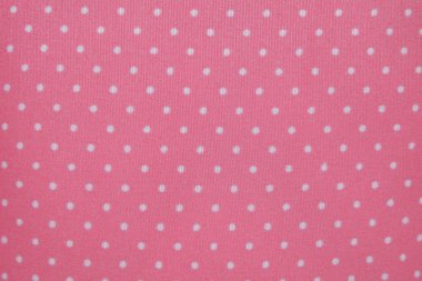 Pembe Tekstil zemin üzerine beyaz küçük lekeli