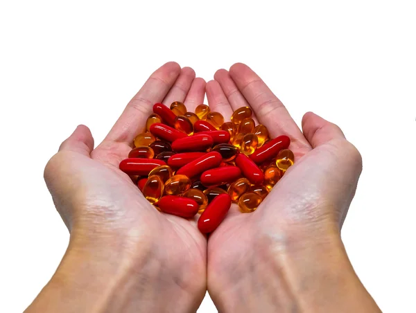 Een heleboel vitamine capsules op handpalms — Stockfoto