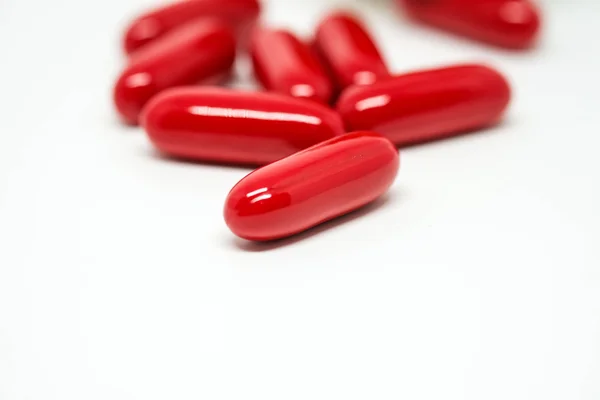 Red capsules in focus — Zdjęcie stockowe