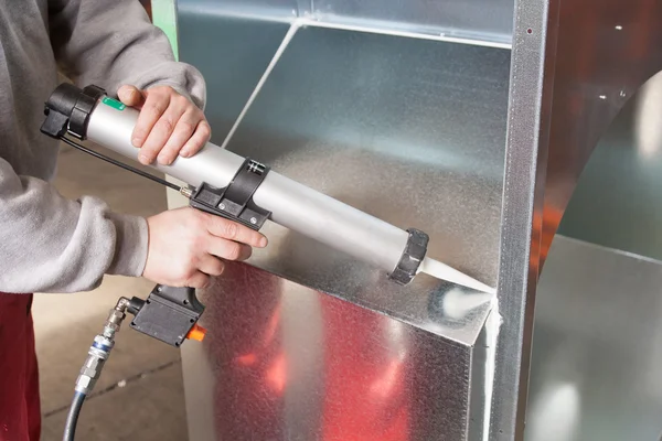 Silicone sealant gun operation — Stock Photo, Image