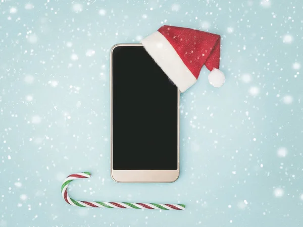 Fondo Concepto Navidad Smartphone Con Sombrero Santa Claus Caña Caramelo — Foto de Stock