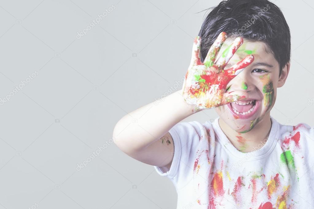 boy with painted face and T-shirt painting