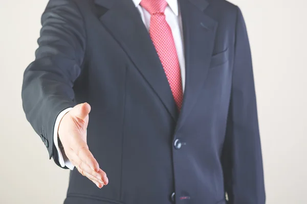 Businessman offering hand — Stock Photo, Image