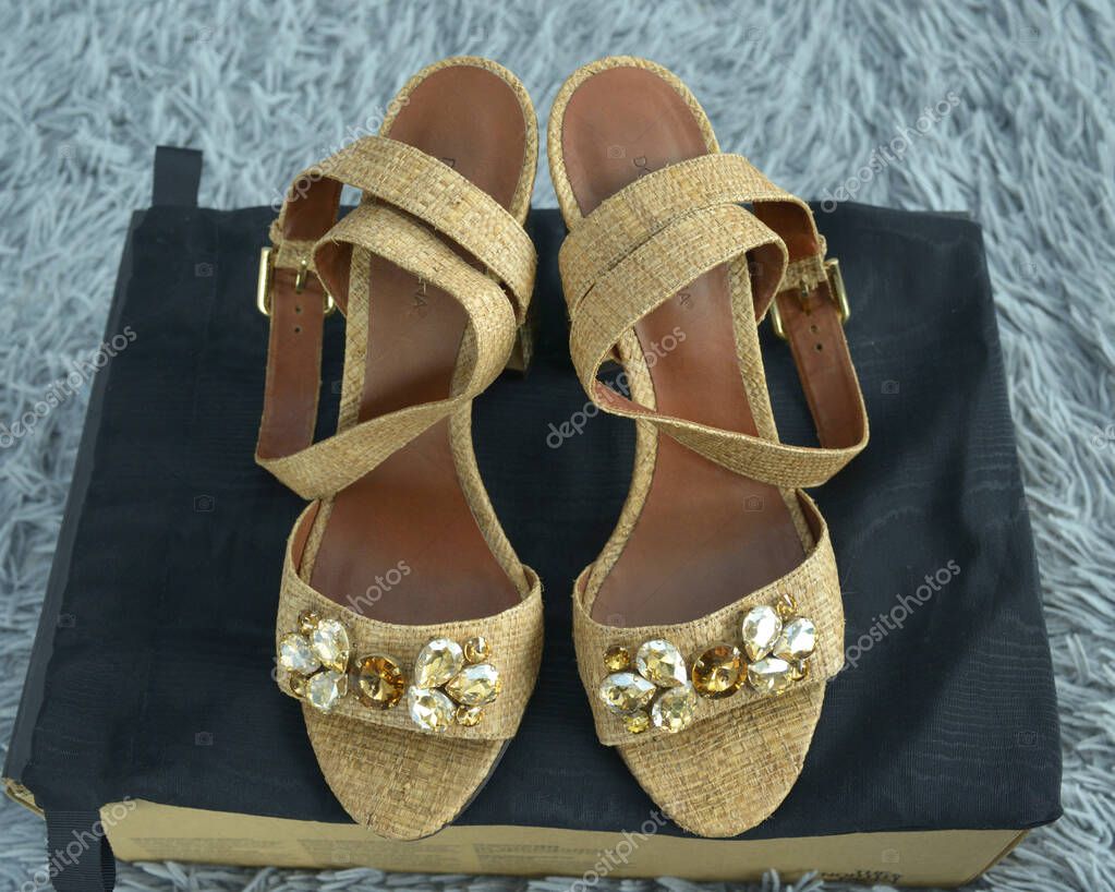 Women sandals Dolce Gabbana made of natural leather and straw with jewelry. November 1, 2025. Kyiv, Ukraine