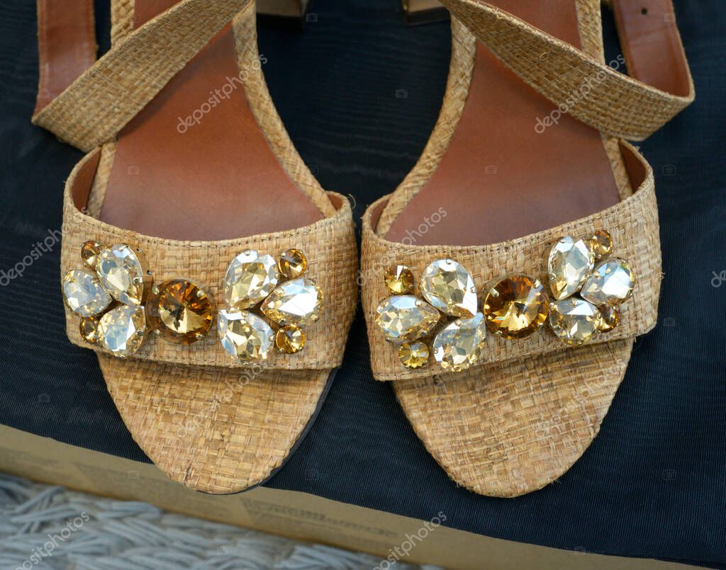 Women sandals Dolce Gabbana made of natural leather and straw with jewelry. November 1, 2025. Kyiv, Ukraine