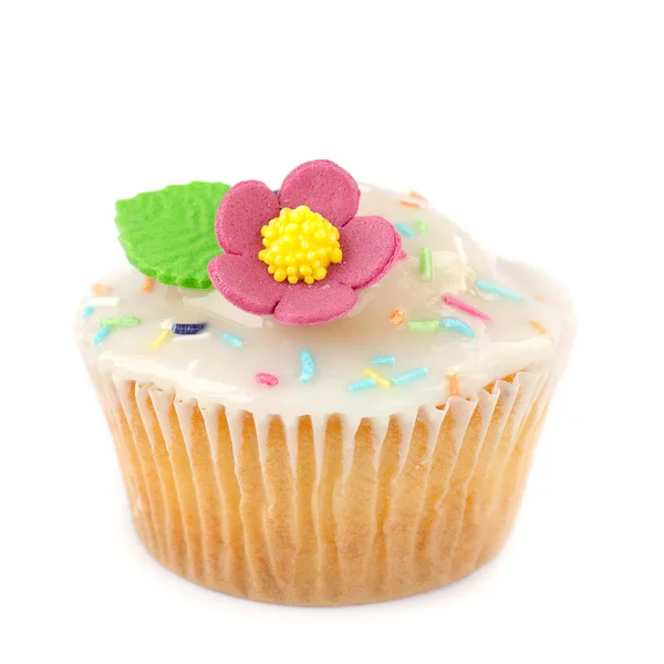 Cupcake com cobertura de açúcar, polvilhas e flor — Fotografia de Stock