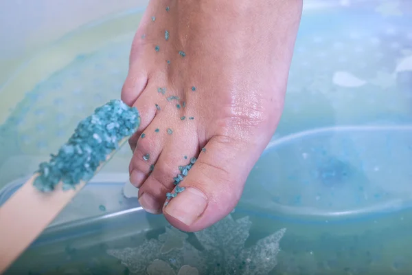 Female feet at spa pedicure procedure — Stock Photo, Image