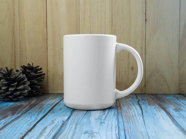 The white mug on table wood for mockup or background