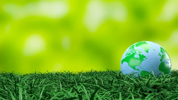 Yeşil ve mavi dünya küresi taze çimenlerin üzerinde dinleniyor. Çevre korumasını, sürdürülebilirliği, iklim farkındalığını ve daha temiz bir geleceğin küresel sorumluluğunu sembolize ediyor.