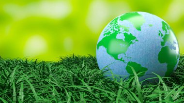 Yeşil ve mavi dünya küresi taze çimenlerin üzerinde dinleniyor. Çevre korumasını, sürdürülebilirliği, iklim farkındalığını ve daha temiz bir geleceğin küresel sorumluluğunu sembolize ediyor.