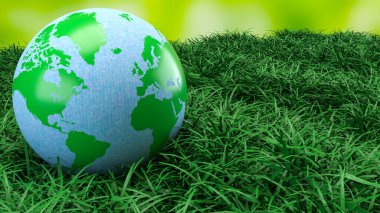 Yeşil ve mavi dünya küresi taze çimenlerin üzerinde dinleniyor. Çevre korumasını, sürdürülebilirliği, iklim farkındalığını ve daha temiz bir geleceğin küresel sorumluluğunu sembolize ediyor.