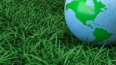 Yeşil ve mavi dünya küresi taze çimenlerin üzerinde dinleniyor. Çevre korumasını, sürdürülebilirliği, iklim farkındalığını ve daha temiz bir geleceğin küresel sorumluluğunu sembolize ediyor.