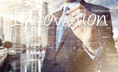 businessman write on transparent board Innovation with sunset over city