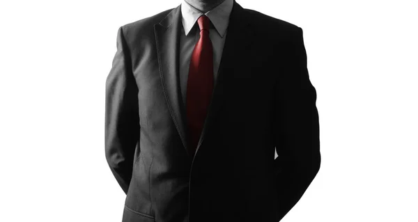 Homem de negócios anônimo de pé isolado no fundo branco — Fotografia de Stock