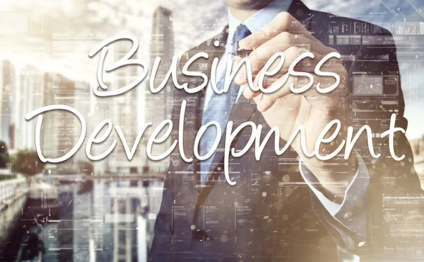 Businessman writing Business Development on transparent board — ストック写真