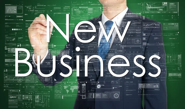 L'homme d'affaires écrit New Business sur le conseil transparent — Photo