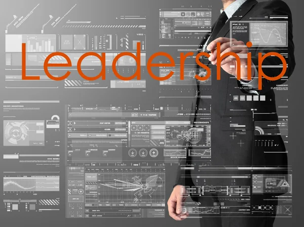 Uomo d'affari scrittura Leadership e disegno grafici e diagrammi — Foto Stock