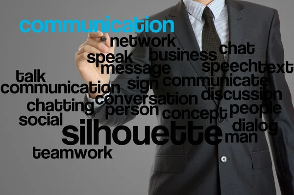 Chmura słowa związane z komunikacji napisane przez biznesmena — Zdjęcie stockowe