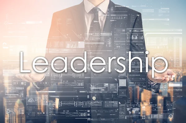 Businessman is presenting text: Leadership