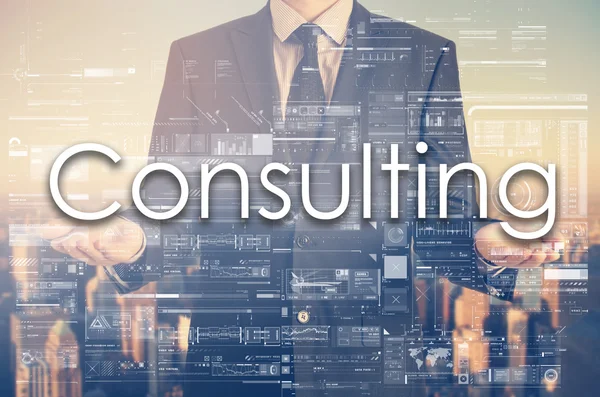 Businessman is presenting text: Consulting — Stock Photo, Image