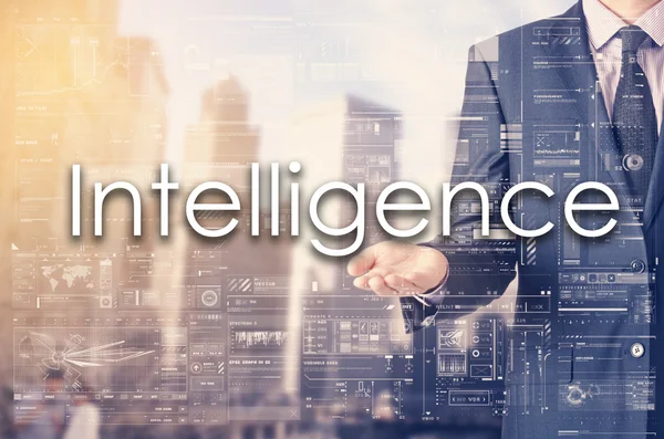 Businessman showing text by his hand: Intelligence — Stock Photo, Image