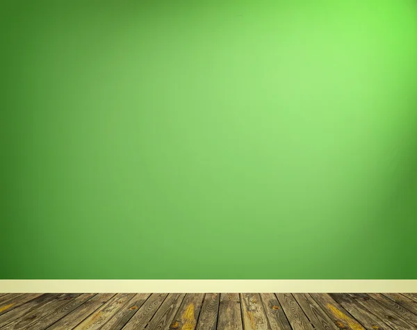 Interno con parete verde e pavimento in legno — Foto Stock