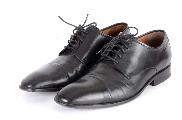 Os sapatos pretos isolados no fundo branco . — Fotografia de Stock