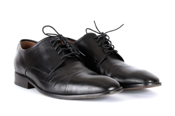 Die schwarzen Schuhe isoliert auf weißem Hintergrund. — Stockfoto