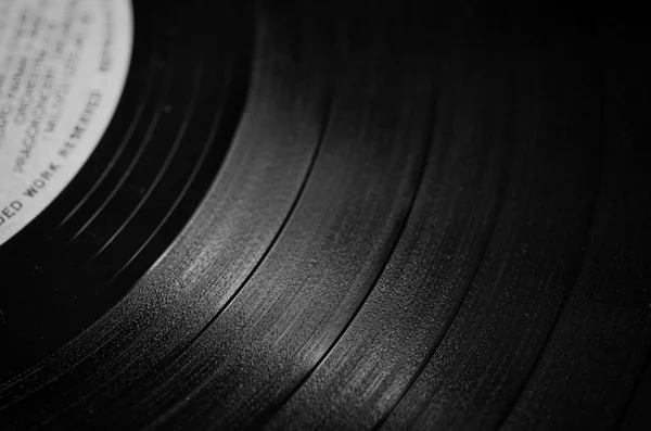 Segment van vinyl record met label weergegeven: de textuur van de groeven — Stockfoto