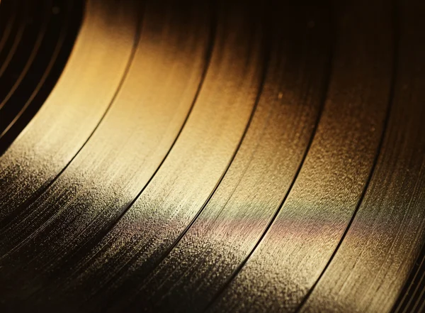 Segmento de disco de vinilo con etiqueta que muestra la textura de las ranuras — Foto de Stock