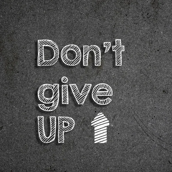 Quadro com DONT GIVE UP escrito nele em branco — Fotografia de Stock