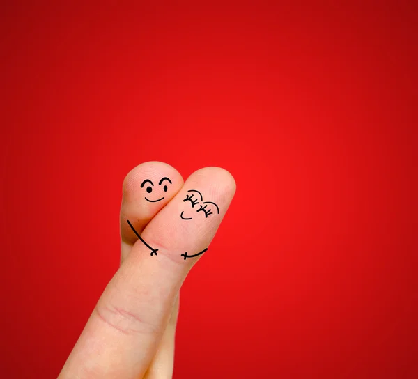 Una feliz pareja enamorada de sonriente pintada y abrazada —  Fotos de Stock