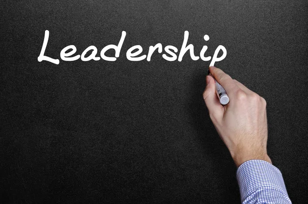 Hand writing a leadership word — Stock Photo, Image