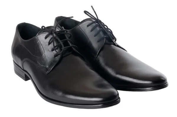 Den svarta mannens skor isolerad på vit bakgrund. — Stockfoto